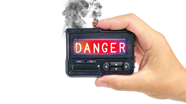 Smoking pager with read screen reading danger