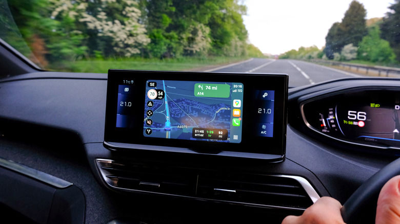 Car dashboard showing map navigation on a screen