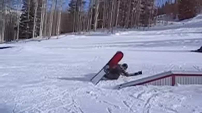 A man rides a snowboard