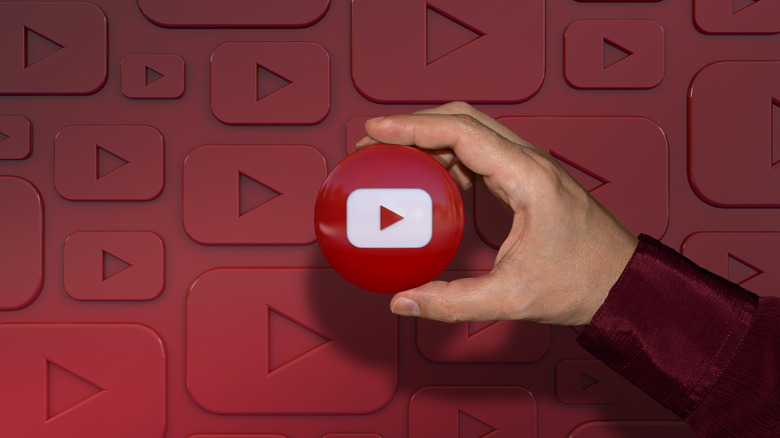 Man holding YouTube logo