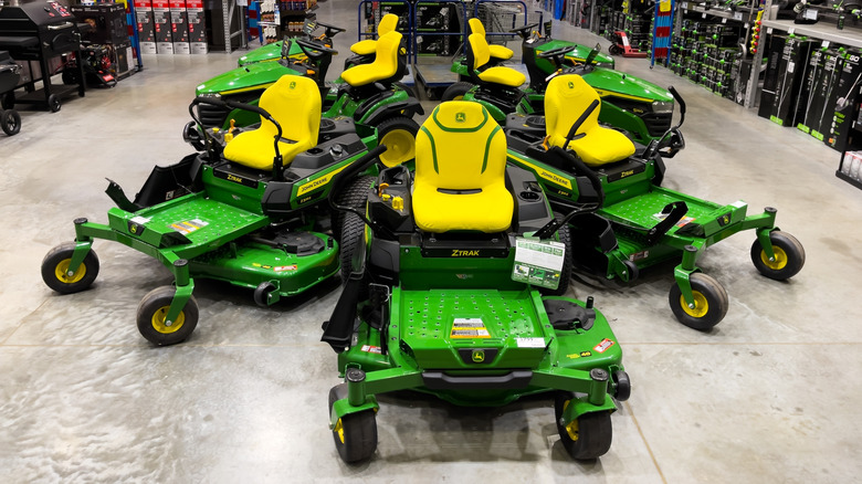 John Deere mowers on display at a hardware store