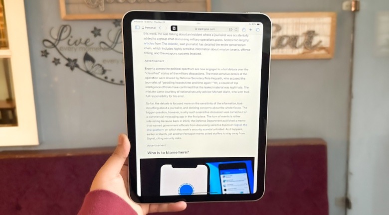 Reading article on iPad.