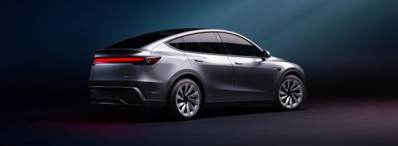 Rear quarter profile of the new Tesla Model Y electric car