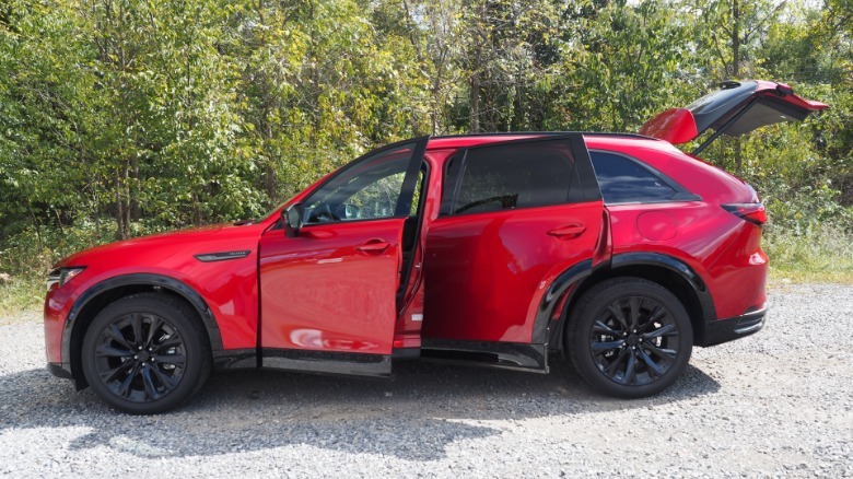 2026 Mazda CX-90 left profile view with doors and rear hatch open
