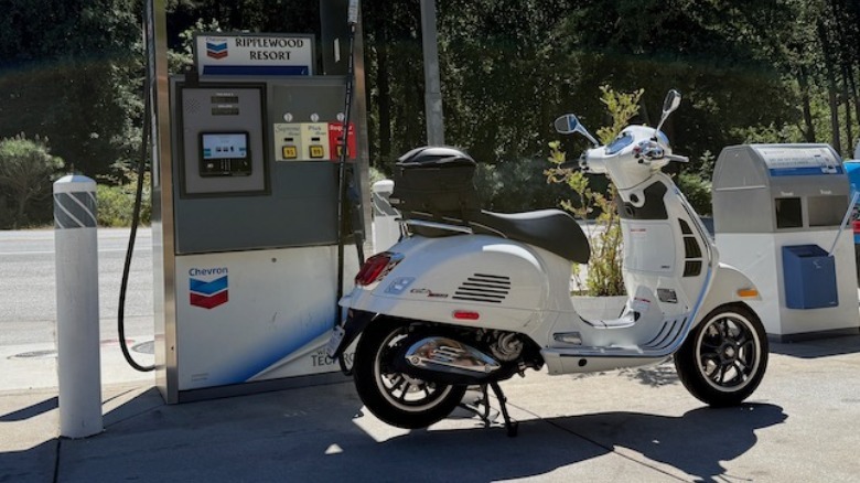 2026 Vespa Gts 310 parked at a gas station