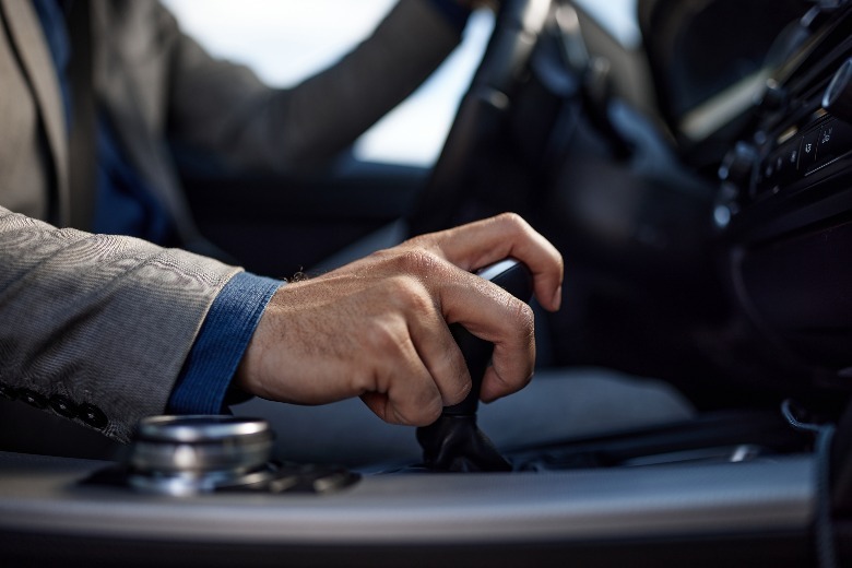person shifting in automatic car