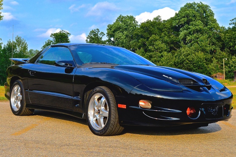 Black 2002 Pontiac Firebird Trans Am parked