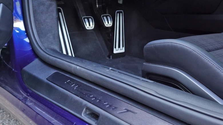 Door sill and three pedals