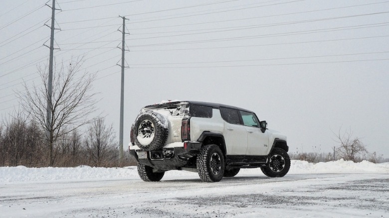 Hummer EV SUV parked in front of power lines