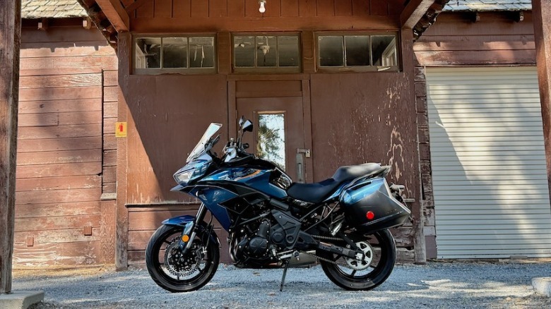 2026 Kawasaki Versys 650 parked at an abandoned garage in Kings Canyon National Park