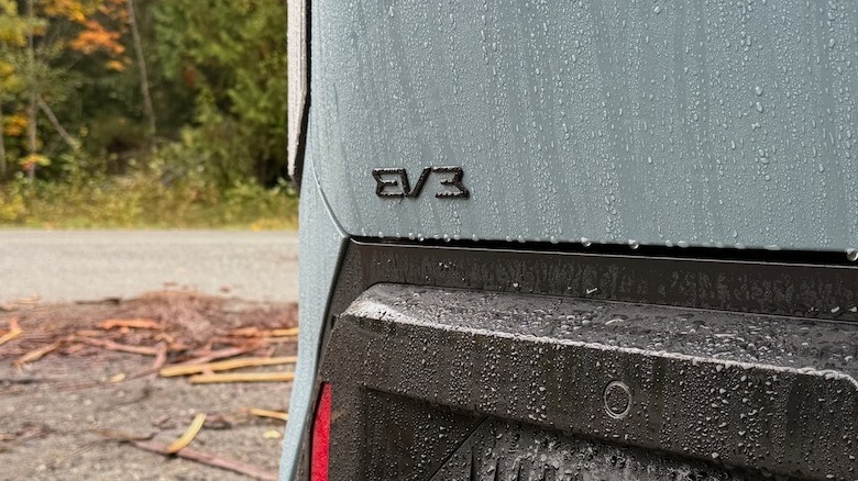 2027 Kia EV3 rear EV3 badge with rain running down it