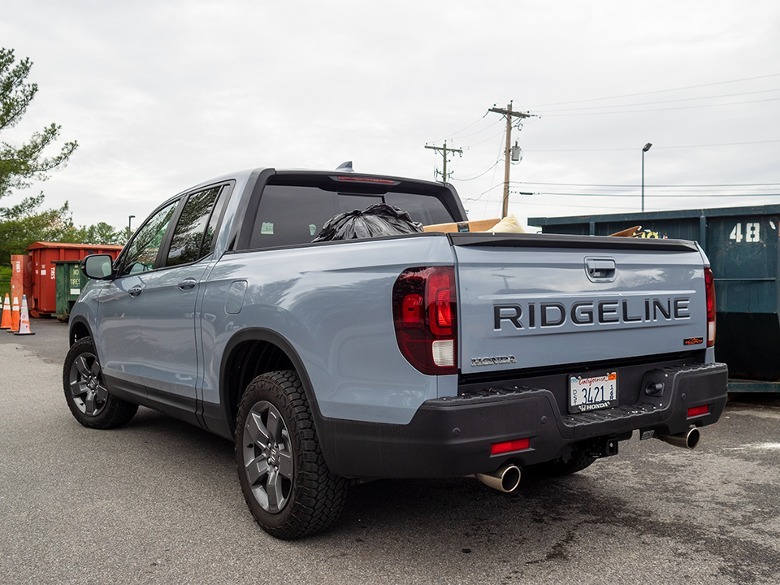 2024 Honda Ridgeline left-rear three-quarter view parked in recycling center