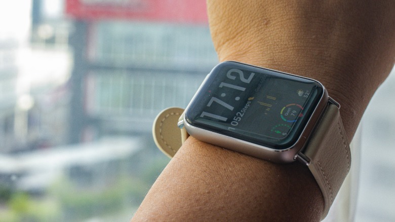 the author's wife wearing the Xiaomi Smart Band 9 Pro with an active watch face