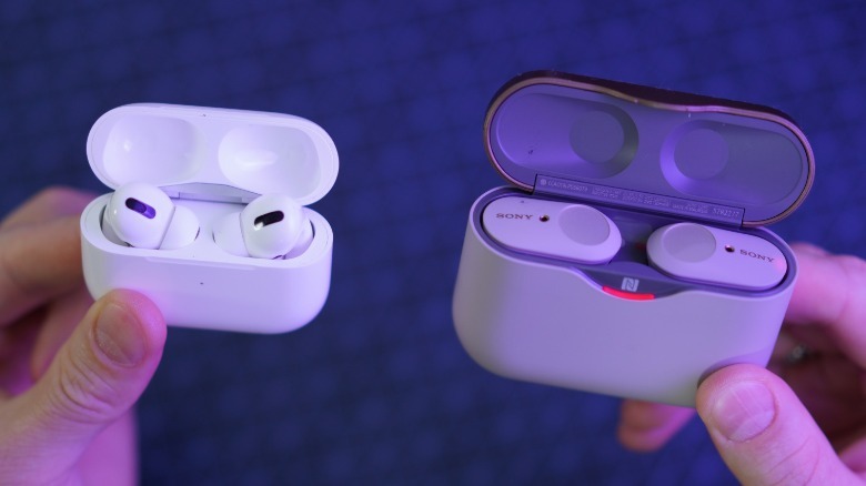 Person holding Sony TWS.