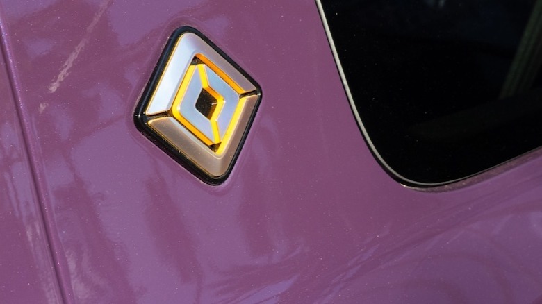 Rivian logo and Aurora Borealis paint sample