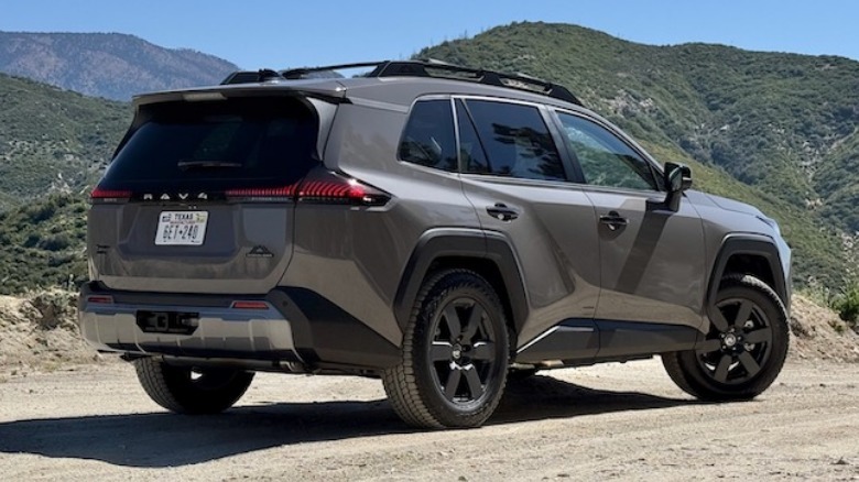 2026 Toyota RAV4 Woodland PHEV parked on a dirt road in the mountains