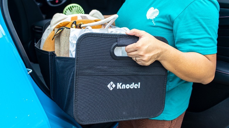 K Knodel Car Trunk Organizer being carried
