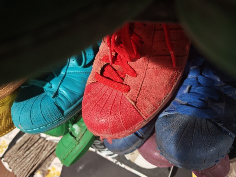 Adidas shoes in multiple colors.