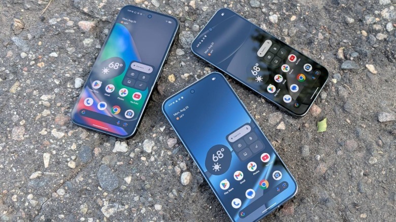 Google Pixel 10 series phones on pavement.