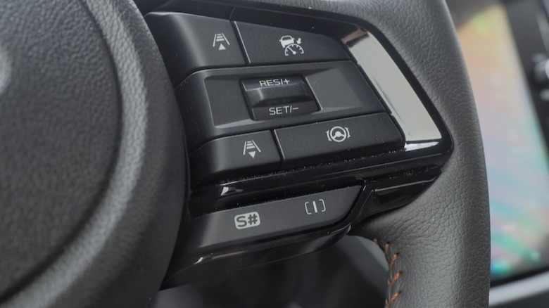 Driver assist buttons on steering wheel