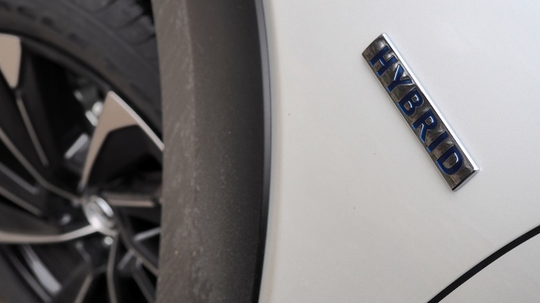 Hybrid badge on the front fender of the CX-50