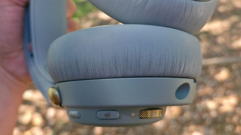 A close-up of the memory foam ear cushions and buttons on the Arctis Nova Elite