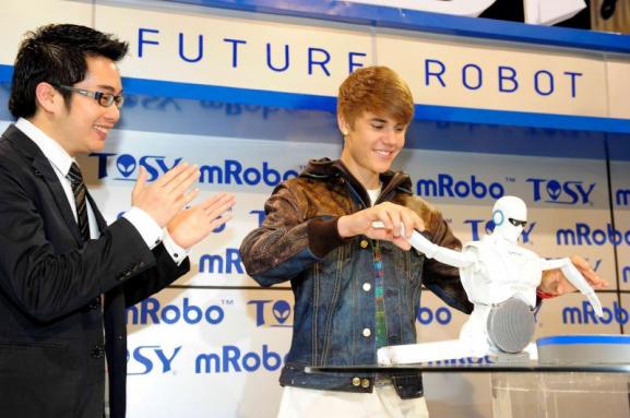 Justin Bieber unveils TOSY mRobo dancing robot at CES 2012