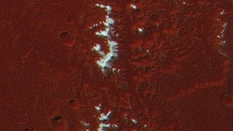 NASA's New Horizons reveals snow-covered mountains on Pluto