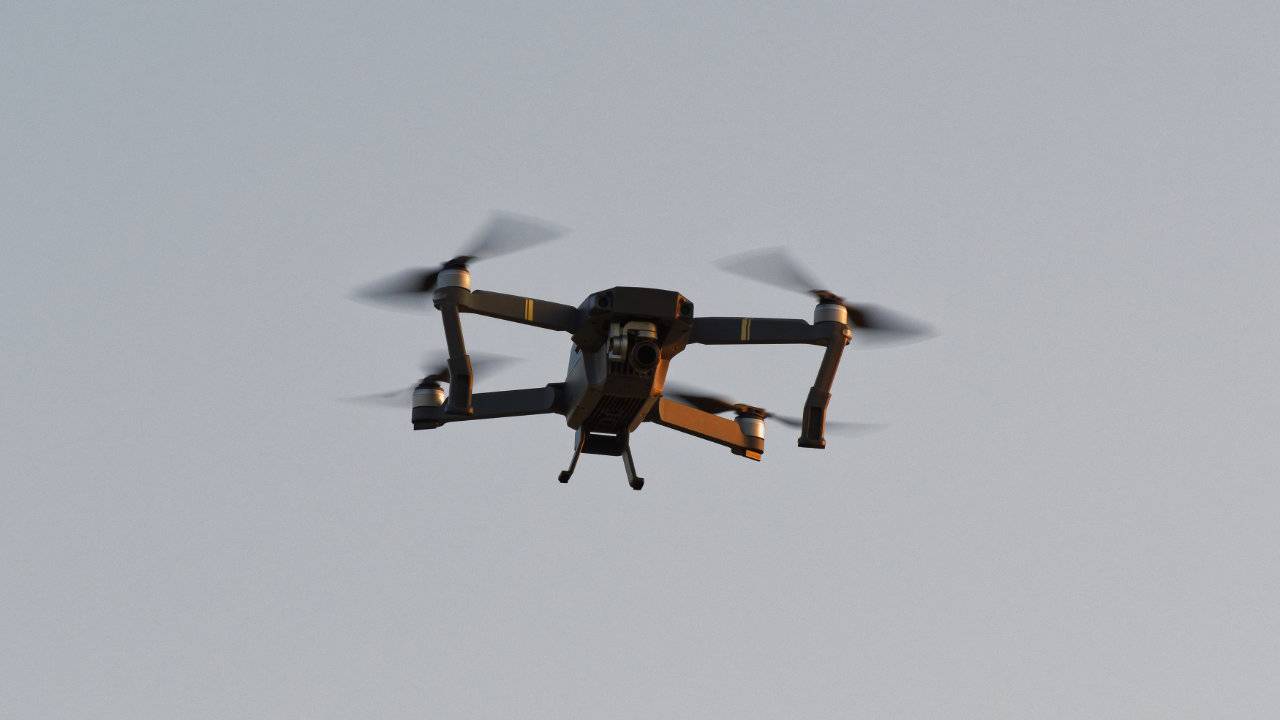DARPA video shows autonomous drones swarming a building