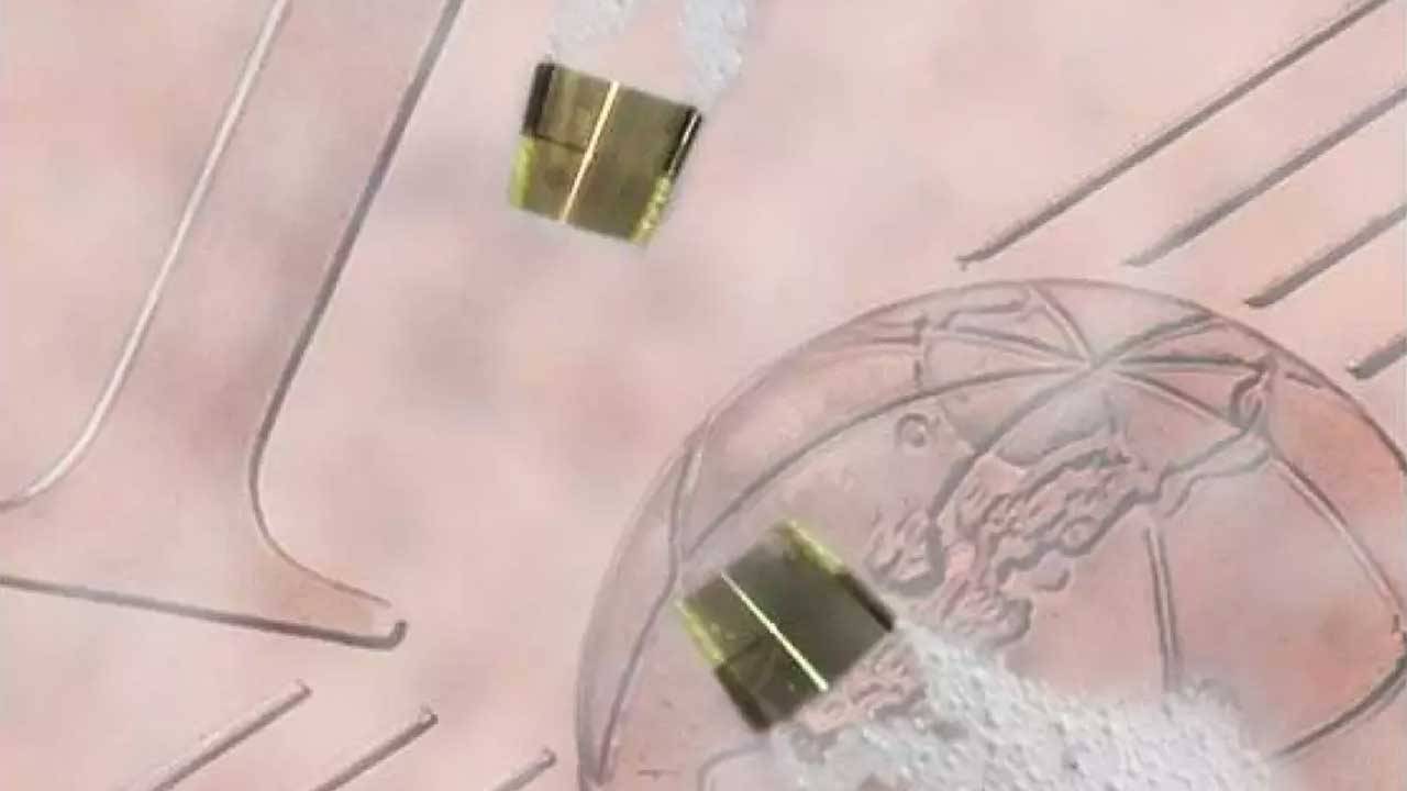 Tiny microelectronic robot is powered by jets of bubbles
