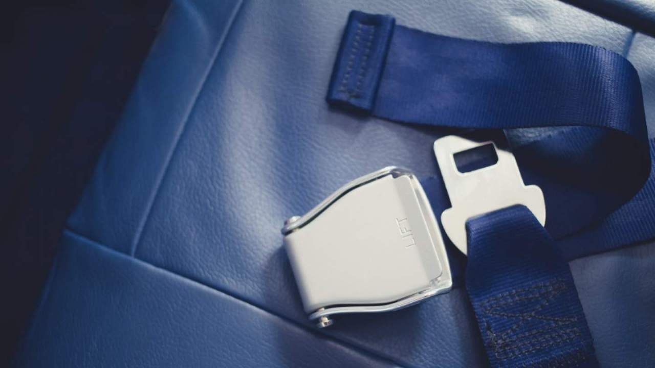Blue airplane seat belt