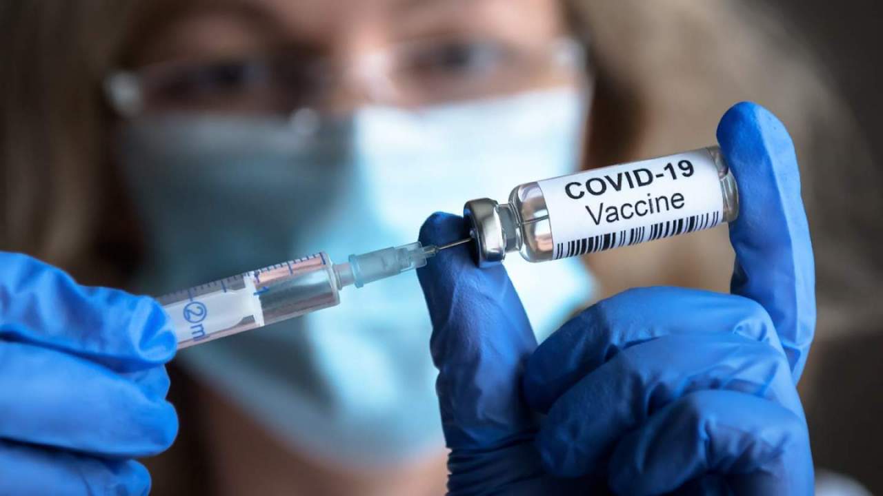 Nurse filling COVID vaccine