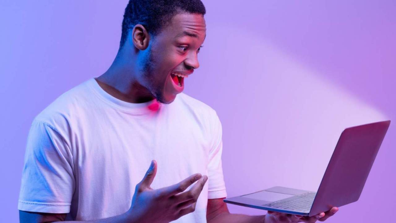 Guy excited by computer