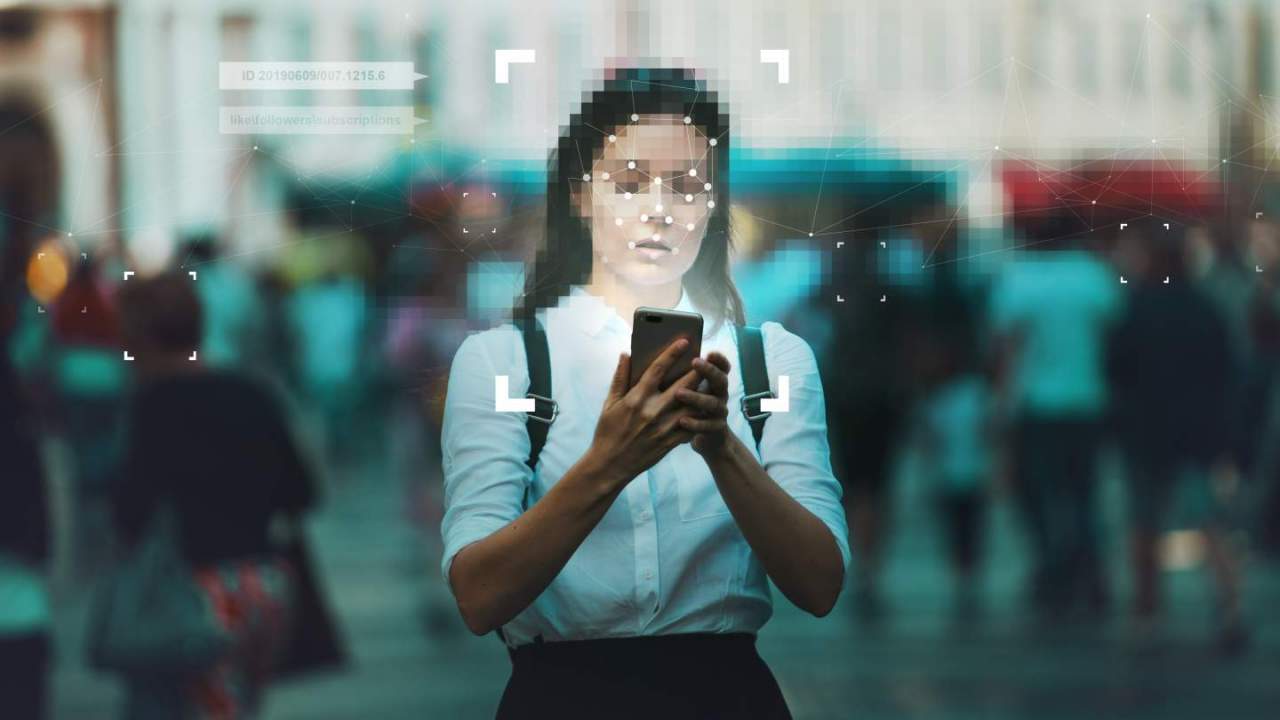 Pixelated woman holding phone