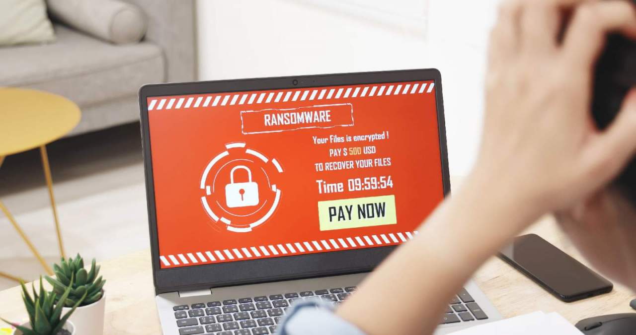 Laptop screen displaying ransomware demands