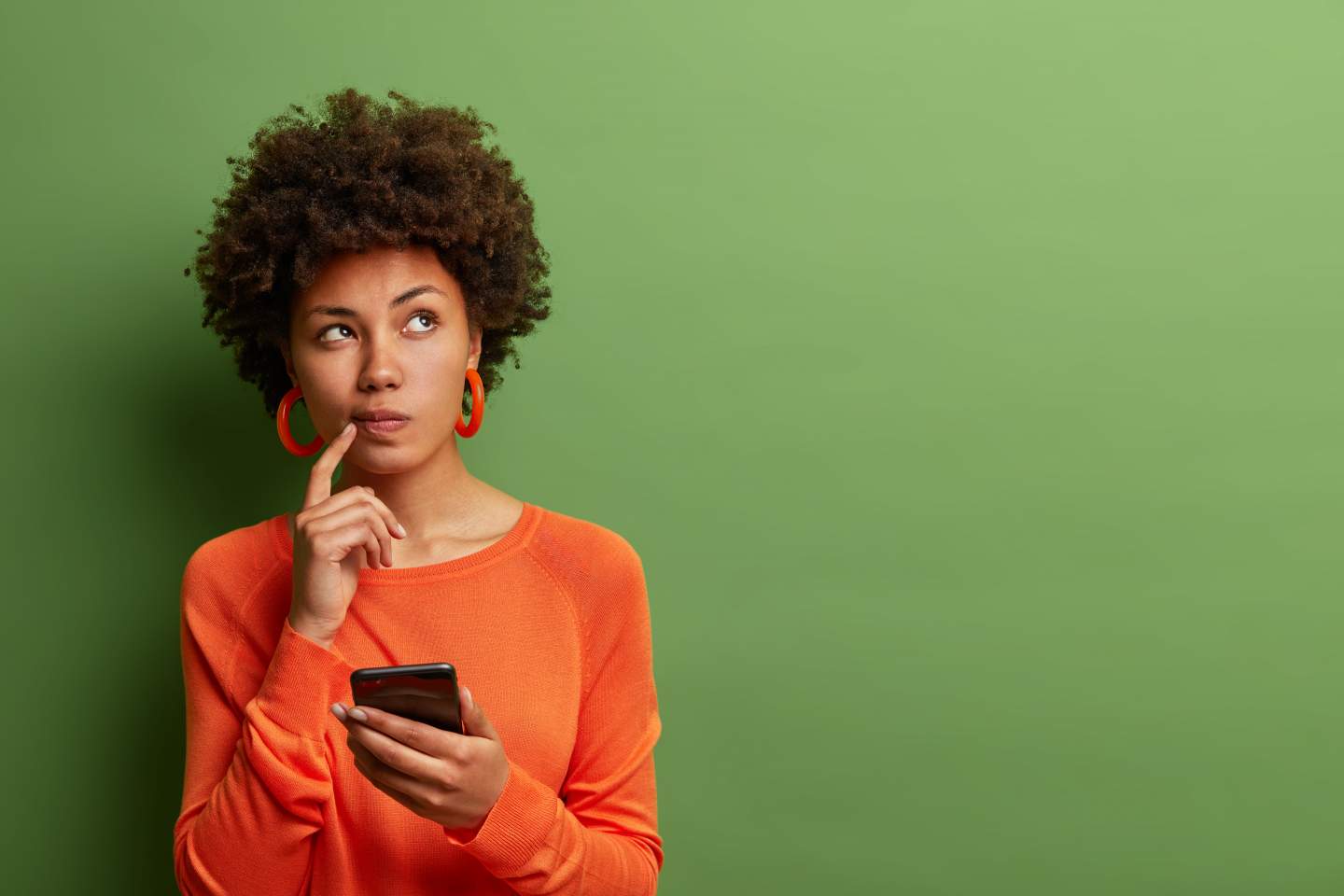 Woman holds a smartphone