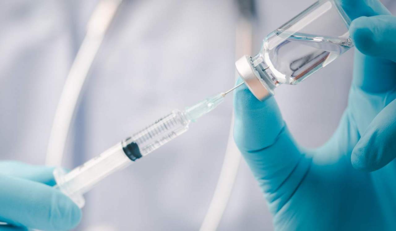 Medical professional with syringe