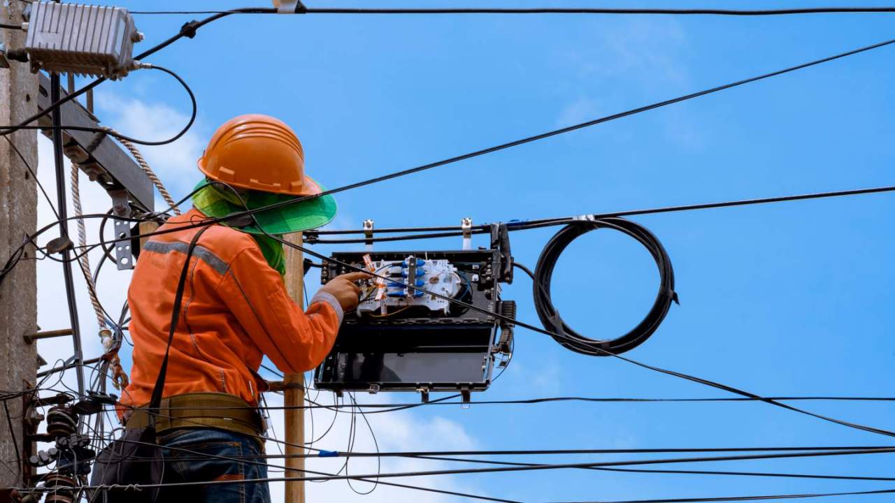 Technician installing fiber optic cable