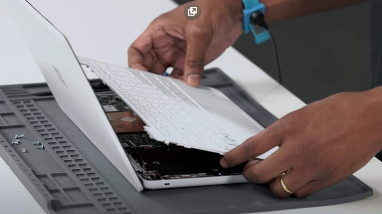 Man removing Surface keyboard